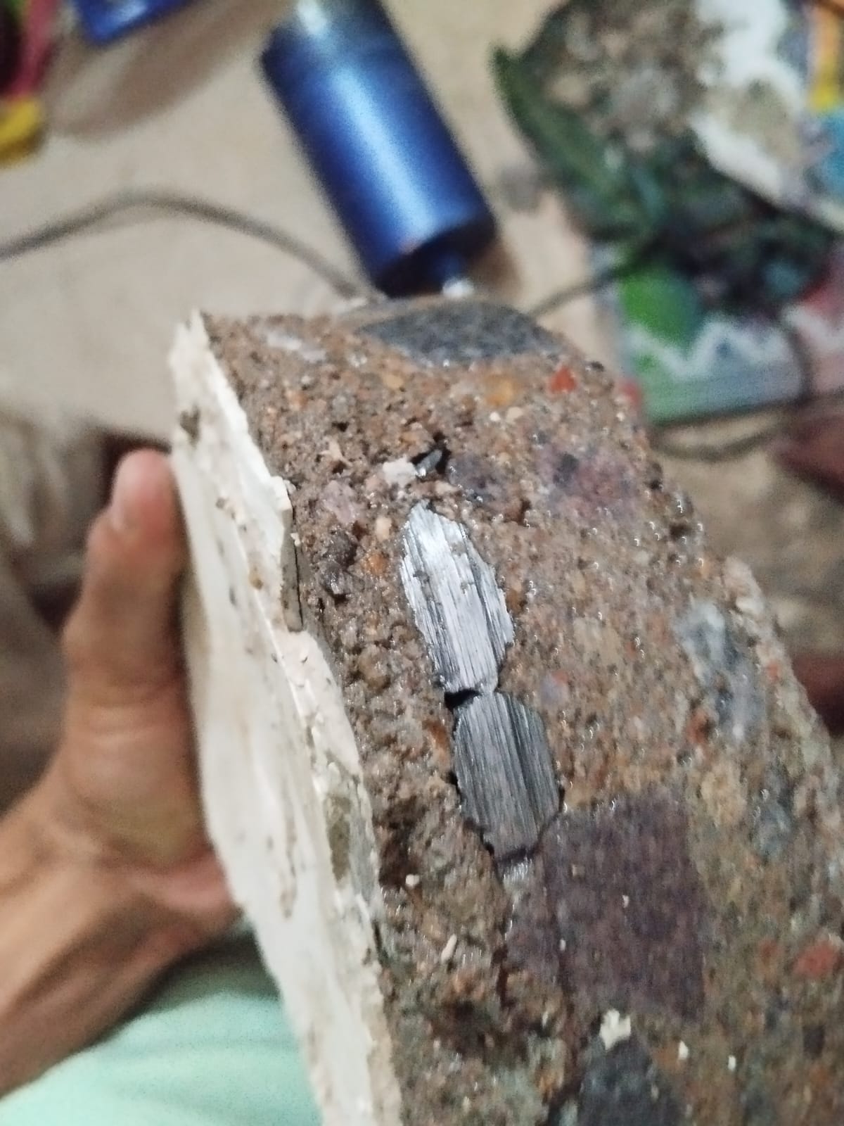 Extracted RCC core specimen showing cleanly cut steel rebar Kanpur